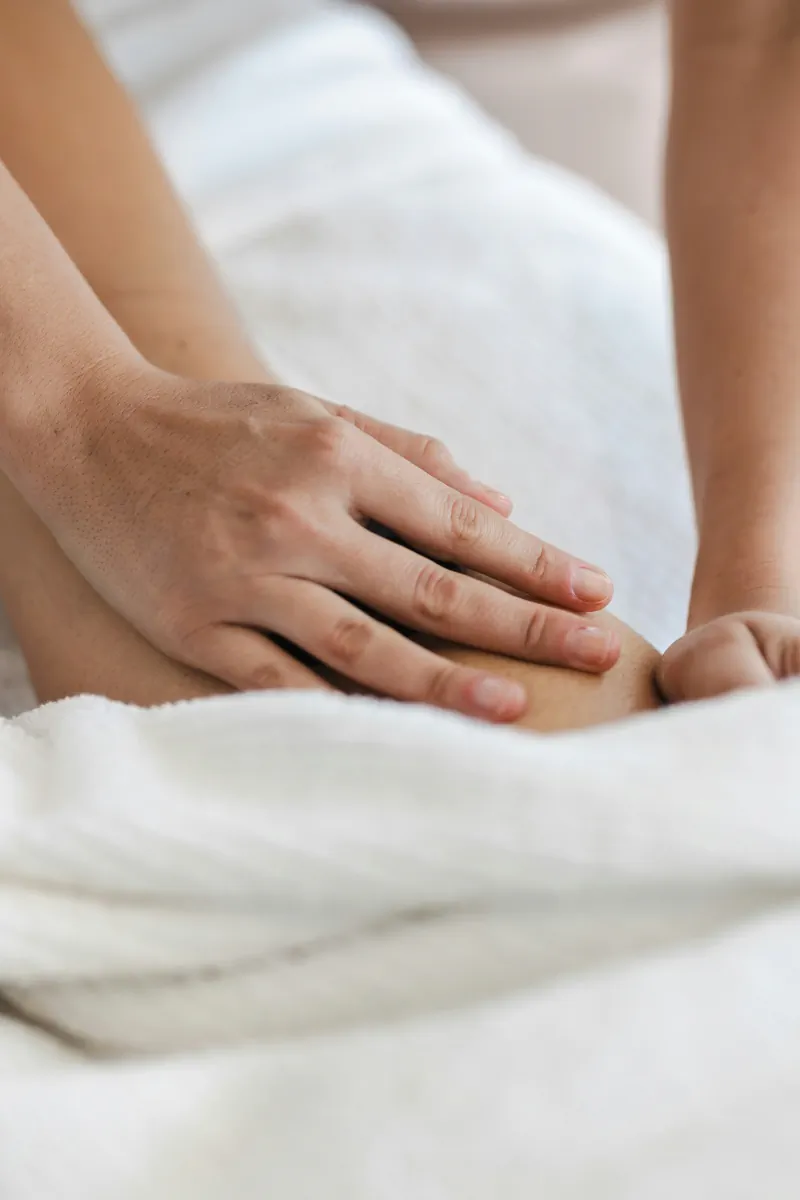 Therapist performing a Traditional Chinese Tui Na massage